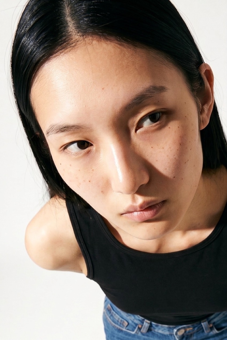 Synthetic talent, long dark hair, close crop — not a real person