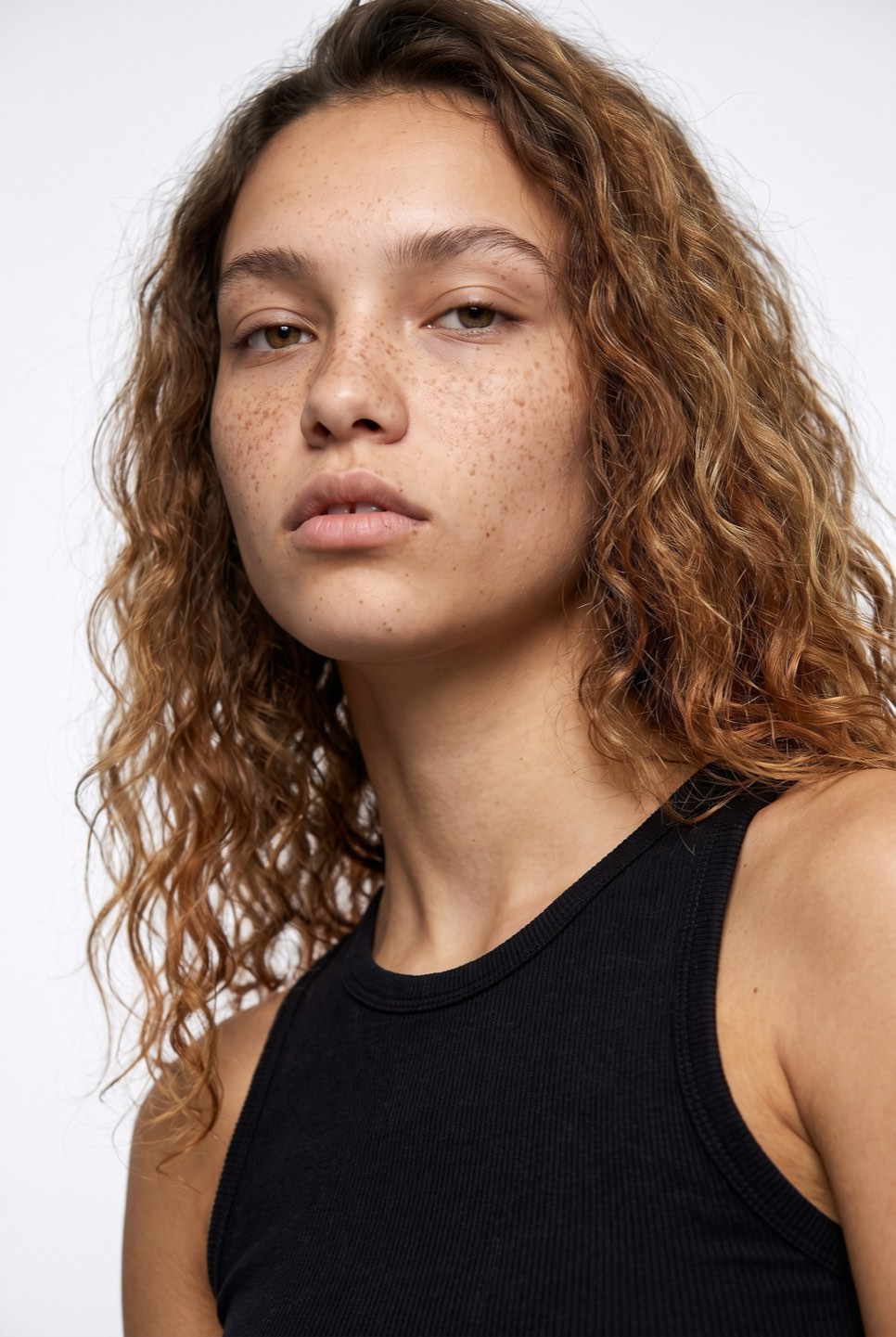 Synthetic talent, curly hair — not a real person