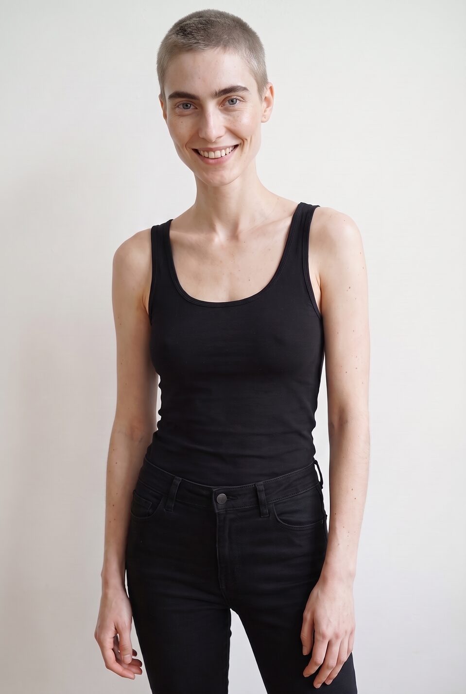 Synthetic talent, cropped blonde hair — not a real person